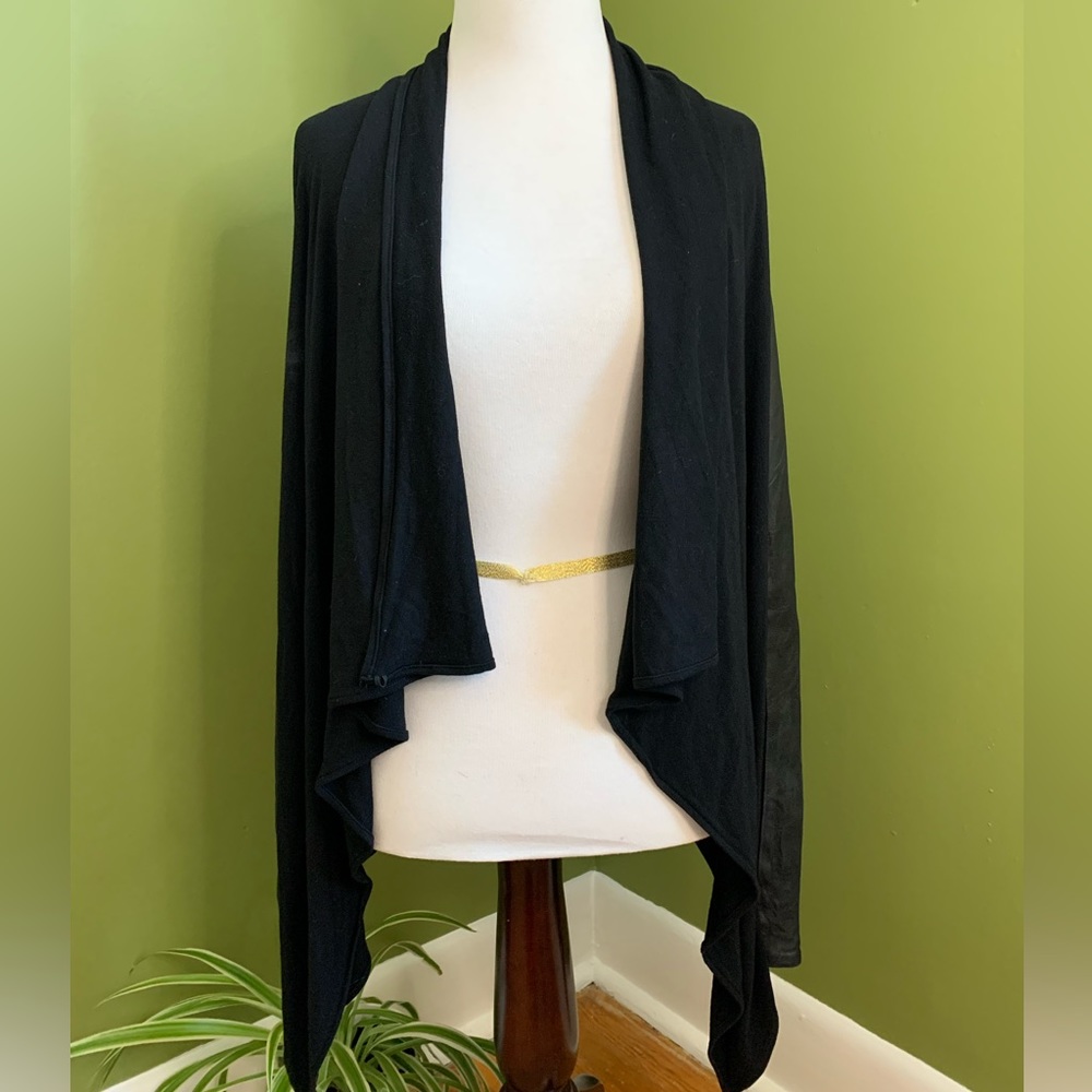 Danier leather wrap with leather sleeves.